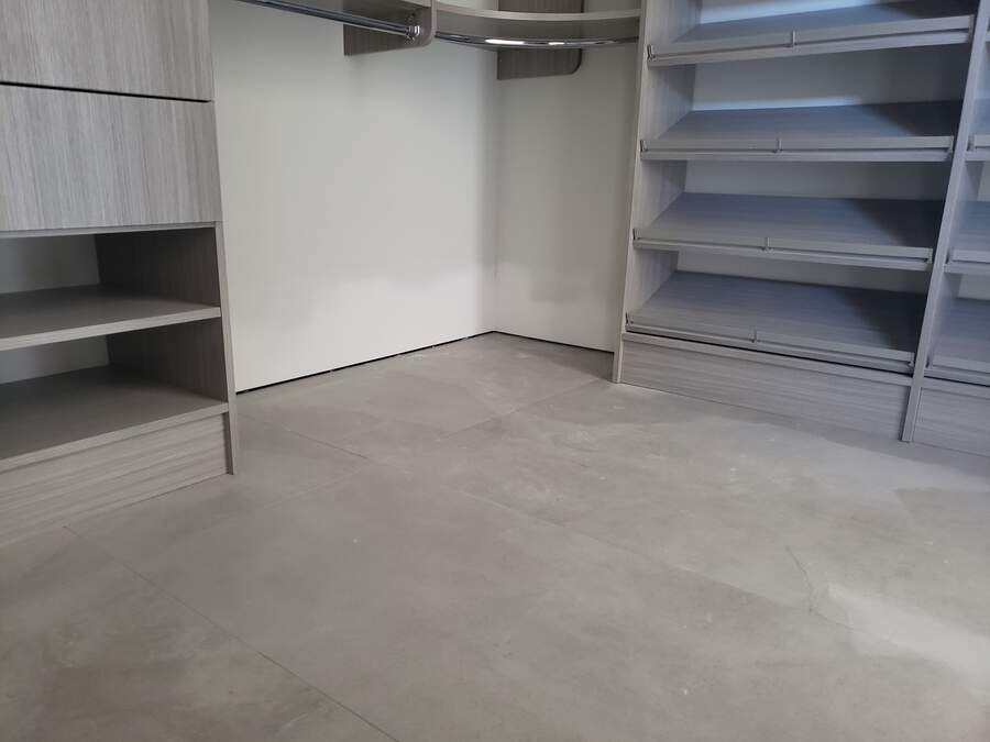 Finished drywall in a bright interior with built-in shelving