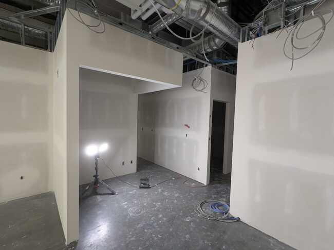 Drywall installation and finishing in progress