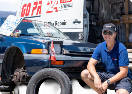 A local service provider beside a work vehicle